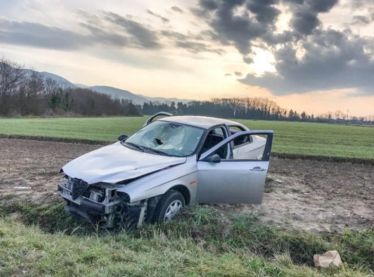broken car on a farm car wreckers auckland