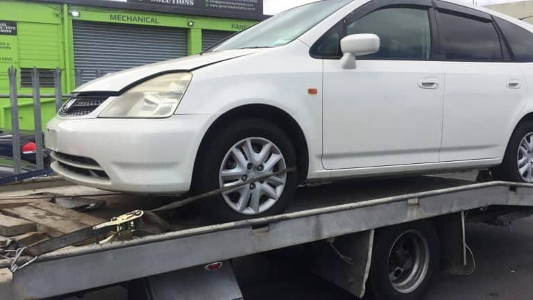 scrap car on truck in south auckland