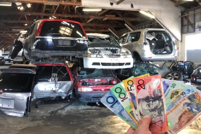 a pile of cars at the car wreckers